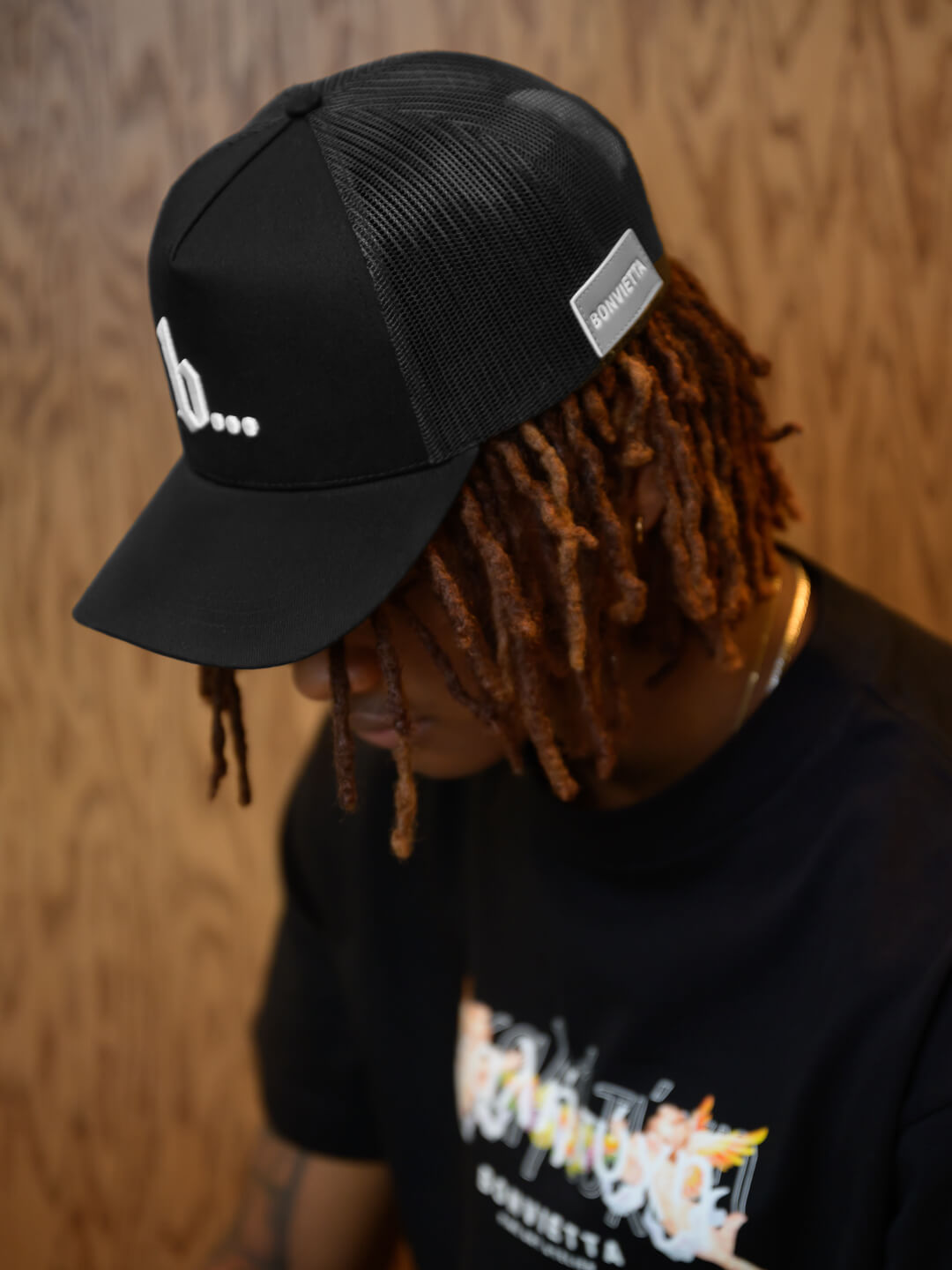 Bonvietta Ellipsis Trucker Hat Styled on Model